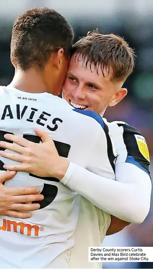  ??  ?? Derby County scorers Curtis Davies and Max Bird celebrate after the win against Stoke City.