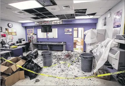  ?? DAMON HIGGINS / THE PALM BEACH POST ?? The roof collapsed early Monday in this classroom at William T. Dwyer High School in Palm Beach Gardens. The tornado left $500,000 to $1 million in damage at the school. The Benjamin School in the city also sustained significan­t damage. No serious...