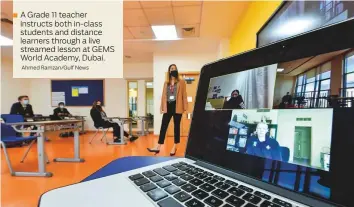  ?? Ahmed Ramzan/ Gulf News ?? A Grade 11 teacher instructs both in- class students and distance learners through a live streamed lesson at GEMS World Academy, Dubai.