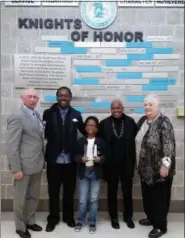 ?? DAN SOKIL — DIGITAL FIRST MEDIA ?? North Penn Knights of Honor inductees Rick Carroll, left, and Cynthia Louden, right, stand with honoree Yolanda Wisher’s husband Mark Palacio, son Theo, and mother Yvonda Wisher.