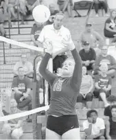  ??  ?? Palm Beach Gardens’ Hannah Heide sends the ball back over the net for a kill against Cypress Bay at Palm Beach Gardens on Tuesday night.