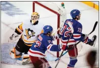  ?? (AP/Frank Franklin II) ?? New York’s Filip Chytil (72) celebrates Wednesday as he skates by Pittsburgh goalie Louis Comingue after scoring the tie-breaking goal early in the third period of the Rangers’ 5-3 victory over the Penguins in New York.