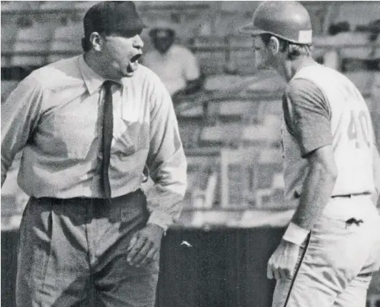  ?? SUN-TIMES ?? Hawk Harrelson (with the Indians at the time) exchanges words with umpire Ron Luciano during the ninth inning of a game at White Sox Park.