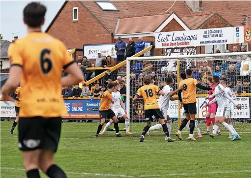  ?? Karl Dunkerley ?? Doug Tharme’s long throw puts Southport ahead after 33 minutes