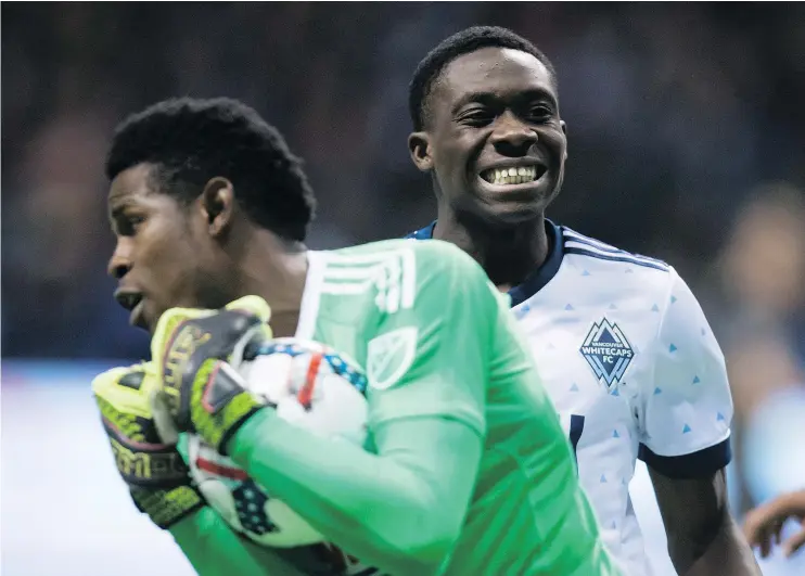  ?? — THE CANADIAN PRESS FILES ?? Vancouver Whitecaps striker Alphonso Davies, back, is playing with confidence and poise against North America’s best despite being only 16 years old.