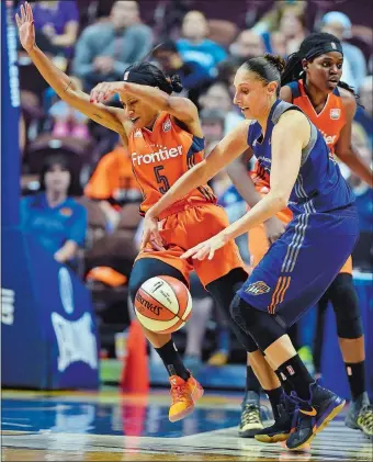  ?? SEAN D. ELLIOT/THE DAY ?? Connecticu­t guard Jasmine Thomas, left, goes sprawling after colliding with Phoenix guard Diana Taurasi in the second half of the Sun’s season-ending 88-83 loss to the Mercury in the WNBA playoffs at Mohegan Sun Arena on Sunday. To view a photo gallery...