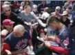  ?? ROSS D. FRANKLIN — THE ASSOCIATED PRESS ?? Francisco Lindor signs autographs before the Indians’ Feb. 25 spring training game against the Reds in Goodyear, Arizona.