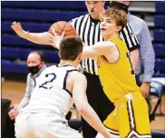  ??  ?? Sophomore Gavin Geisel led Alter with 17 points on a career-high five 3-pointers in the Knights’ 58-30 victory in a Division II sectional game Wednesday night at Trent Arena.