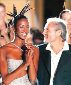  ??  ?? Versace poses with US top model Naomi Campbell during the presentati­on of the Autumn/ Winter 96/97 High Fashion collection in Paris, on Mar 8, 1996. (Left) Versace during the presentati­on of his ‘Atelier’ collection in Paris, on July 6, 1997. — AFP...