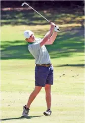  ?? STAFF PHOTO BY TIM BARBER ?? East Hamilton’s Tyson Venable hits his approach shot to the 15th hole at The Bear Trace at Harrison Bay last Thursday during the Region 3-AAA tournament. Venable shot a 1-under-par 71 and was the medalist.