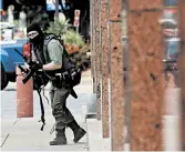  ?? TOM FOX/THE DALLAS MORNING NEWS ?? A shooter armed with a rifle attacked at the Earle Cabell Federal Building on Monday morning in downtown Dallas.