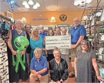  ?? AQEEL HISHAM/ PORTSMOUTH HERALD ?? Trends Gift Gallery made $14,809.96 in sales from UFO Festival merchandis­e. All profits were donated back to the Exeter Area Kiwanis Club.