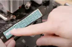  ??  ?? Remember to remove the plastic sheet from the thermal paste before you install the shield over the SSD.