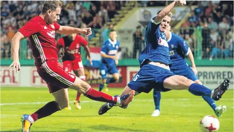  ?? Picture: SNS. ?? Former Dundee star Greg Stewart fires home his first goal in Aberdeen colours in Bosnia.