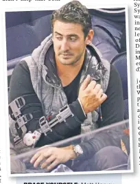  ?? WireImage ?? BRACE YOURSELF: Matt Harvey wears a brace to a Rangers game after Tommy John surgery in 2013.