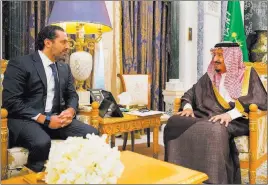  ??  ?? The Associated Press In this photo provided by the Saudi Press Agency, Saudi King Salman, right, meets with outgoing Lebanese Prime Minister Saad Hariri in Riyadh on Monday. Hariri announced his resignatio­n in a televised statement from Saudi Arabia on...