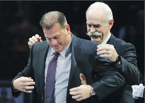  ?? BRUCE BENNETT/GETTY IMAGES ?? Kamloops native Mark Recchi is honoured for his induction into the Hockey Hall of Fame before the Legends Classic game Sunday at the Air Canada Centre in Toronto. Recchi had a standout 22-year NHL career in which he won three Stanley Cups.