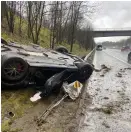  ??  ?? Flipped Ferrari on M62. Below, car stuck on the Yorkshire moors