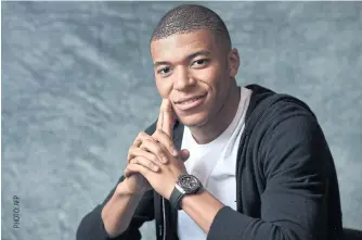  ??  ?? Kylian Mbappe poses during a promotiona­l event for Hublot.