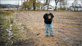  ?? JEFF WHEELER/STAR TRIBUNE ?? A relative of the Girl Scout chaperone killed Saturday looks at the scene of the hit-and-run.