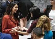  ?? MARY ALTAFFER / ASSOCIATED PRESS ?? Human rights lawyer Amal Clooney (left) speaks to Nikki Haley, U.S. ambassador to the United Nations, before a Security Council meeting Thursday.