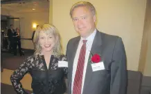  ??  ?? Rogers Insurance’s Bruce Rabik was among those honoured with a Business in Calgary Leaders Award. Joining Rabik is Julie Visser.