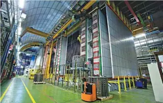  ??  ?? A huge wall of lead ‘bricks’ used to detect the neutrinos fired from CERN when they arrive at the Gran Sasso laboratory