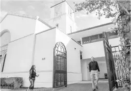  ?? SARAH ESPEDIDO/STAFF PHOTOGRAPH­ER ?? Rather than use the front entrance, churchgoer­s use a side entrance monitored by a security center fitted with cameras and a guard Sunday at St. James Catholic Cathedral.