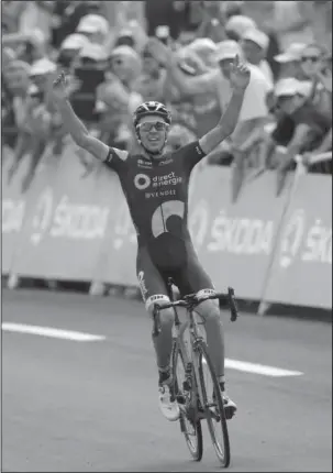  ?? The Associated Press ?? FAVORITE SON: France’s Lilian Calmejane celebrates as he crosses the finish line to win the eighth stage (116.5 miles) of the Tour de France Saturday.