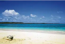  ??  ?? Naked Island, a sandbar of powdery white sand surrounded by different shades of blue