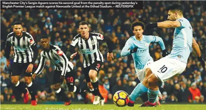  ??  ?? Manchester City’s Sergio Aguero scores his second goal from the penalty spot during yesterday’s English Premier League match against Newcastle United at the Etihad Stadium. – REUTERSPIX