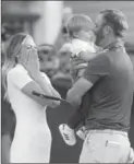  ?? CHARLES LECLAIRE, USA TODAY SPORTS ?? Dustin Johnson celebrates with fiancé Paulina Gretzky while holding their son Tatum after winning the U.S. Open golf tournament at Oakmont Country Club.