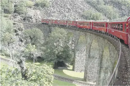  ?? RICK STEVES ?? Taking a train like Switzerlan­d’s Bernina Express keeps you close to Europe’s charms.