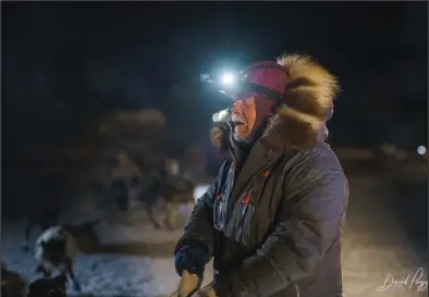  ?? Photo courtesy The Iditarod/Dave Poyzer ?? LEAVING NIKOLAI— Aaron Burmeister gets ready to leave Nikolai.