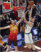  ?? RICK BOWMER — THE ASSOCIATED PRESS ?? The Celtics’ Gordon Hayward goes to the basket as Joe Ingles of the Jazz defends. Utah won 123-115.