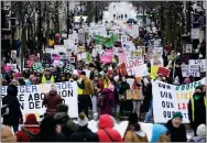  ?? MORRY GASH/ASSOCIATED PRESS ?? Protesters make their way to the Wisconsin Capitol Rotunda during a march supporting overturnin­g Wisconsin’s near total ban on abortion Sunday, Jan. 22, 2023, in Madison, Wis.