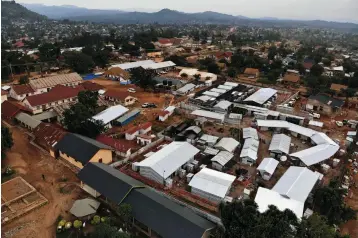  ?? Associated Press ?? ■ This July 13 picture shows an Ebola treatment center set up next to the hospital in Beni, Congo. Nearly one year into the epidemic which has killed more than 1,700 in eastern Congo, a rise in community deaths is fueling a resurgence of Ebola in Beni. During a two-week period in July alone there were 30 people who died at home in the town.