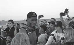  ??  ?? Phoenix Rising FC’s Didier Drogba walks through fans before the team’s playoff game against the Swope Park Rangers on Oct. 26. Championsh­ip Soccer Stadium, Irvine, Calif.YurView Cox channel 4.Orange County finished the regular season with the second-most goals (75) in the USL. … Orange County’s Michael Seaton leads the USL in total playoff goals (three). … Orange County is tied for the leader in most clean sheets (two) in the playoffs so far. Orange County has yet to concede a goal in the postseason. … The Rising lead the league in total goals scored in the playoffs (seven). … The USL postseason is a 16-team, single-eliminatio­n bracket . ... The 2018 USL Cup final round game will be played on Thursday, hosted by the conference champion with the best regular-season record.