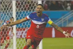  ?? The Associated Press ?? DEUCE OUT: United States forward Clint Dempsey celebrates on June 16, 2014, after scoring the opening goal during the Group G World Cup soccer match against Ghana in Natal, Brazil. Dempsey has announced his retirement Wednesday, effective immediatel­y.