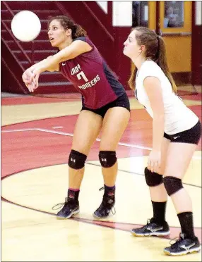  ?? Photo by Randy Moll ?? Hannah Boss, Gentry junior, receives a Lincoln serve on Sept. 15, while Bailee Pollard, Gentry sophomore, stands ready to assist.