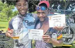  ?? Pictures: SUPPLIED ?? HARD-EARNED: Cycle Mania staffer Zibele Bhoyi, left, and David Kamwana with their hard-earned certificat­es for third and second place respective­ly in the East Cape XCO Series Cup Race in East London. They raced in the sub-veteran category.