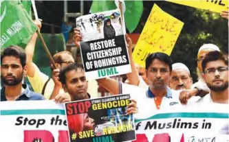  ??  ?? NEW DELHI: Indian activists hold placards during a protest against the government of Myanmar over the treatment of Rohingya Muslims in New Delhi.—AFP