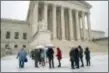  ?? J. SCOTT APPLEWHITE — THE ASSOCIATED PRESS ?? Visitors wait to enter the Supreme Court as a winter snow storm hits the nation’s capital making roads perilous and closing most federal offices and all major public school districts, on Capitol Hill in Washington, Wednesday.