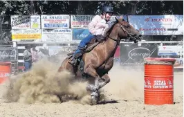  ??  ?? Turning hard . . . Nancy Franco, of Kaiapoi, competes in the open barrel race.