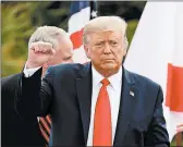  ?? JOE RAEDLE/GETTY ?? President Donald Trump leaves the Jupiter Inlet Lighthouse in Florida after his offshore drilling announceme­nt.