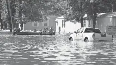  ?? DANIELLE PARHIZKARA­N, NORTHJERSE­Y.COM VIA USA TODAY NETWORK ?? Search-and-rescue teams float through Beaumont on Saturday.