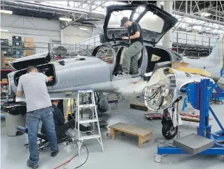  ?? MORRIS LAMONT/FILES ?? Workers at Diamond Aircraft assemble a DA62 plane at a factory in London, Ont. Trade in aircraft, metal ores, nonmetalli­c minerals, and other transporta­tion and parts hit record highs in June.