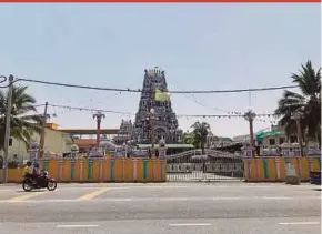  ?? PIX BY ADIB POVERA ?? The Arulmigu Samayapura Maha Mariamman Temple, whose ‘gopuram’ (entrance temple) stands tall and is decorated with colourful statues, in Tanjung Rambutan.