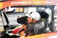  ?? AP Photo/Chuck Burton ?? ■ Chase Elliott prepares for practice for today’s NASCAR Cup Series auto race at the Circuit of the Americas on Saturday in Austin.