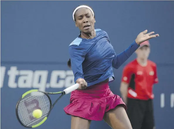  ?? JON BLACKER/THE CANADIAN PRESS ?? Venus Williams’ match against Irina-Camelia Begu was suspended Monday with Williams up 2-1 in the third set.